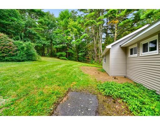 8 Allen Hill Road Holland, MA 01521 - Photo 24 of 41 a backyard of a house with plants and large trees