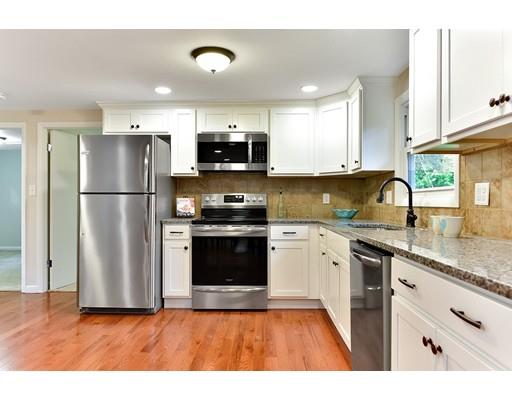 8 Allen Hill Road Holland, MA 01521 - Photo 8 of 41 a kitchen with stainless steel appliances granite countertop a refrigerator a sink a stove a microwave and wooden floor