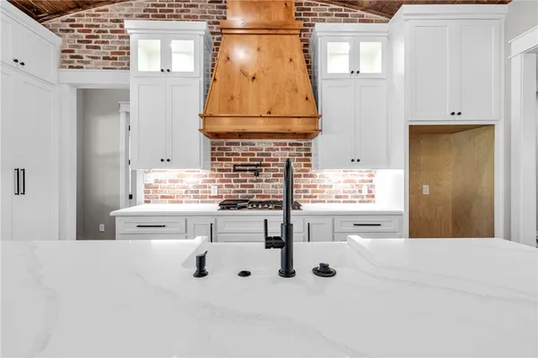 a kitchen with kitchen island cabinets and window