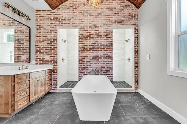 a bathroom with a bathtub and a sink