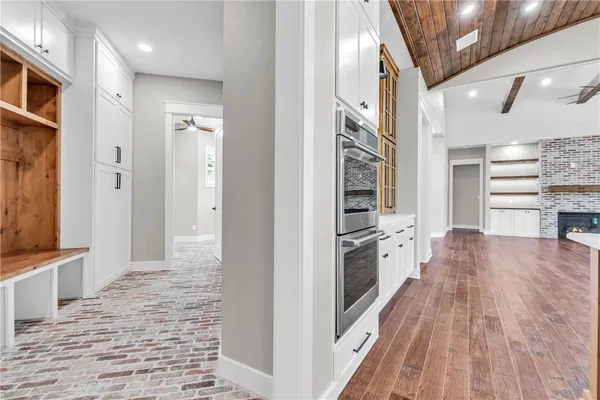a view of a kitchen cabinets and wooden floor