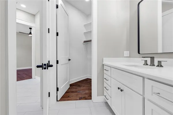 a bathroom with a double vanity sink and mirror