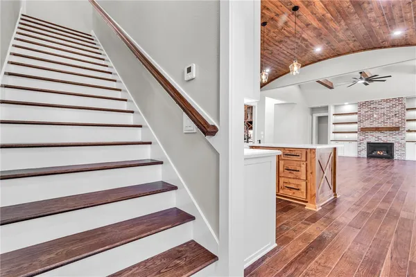 a view of entryway and hall with wooden floor