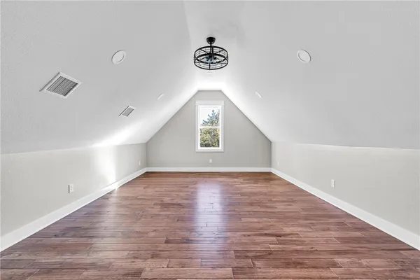 a view of an empty room and a window