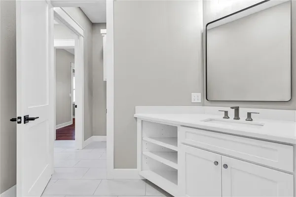a bathroom with a sink and a mirror