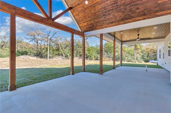 a view of porch with a yard