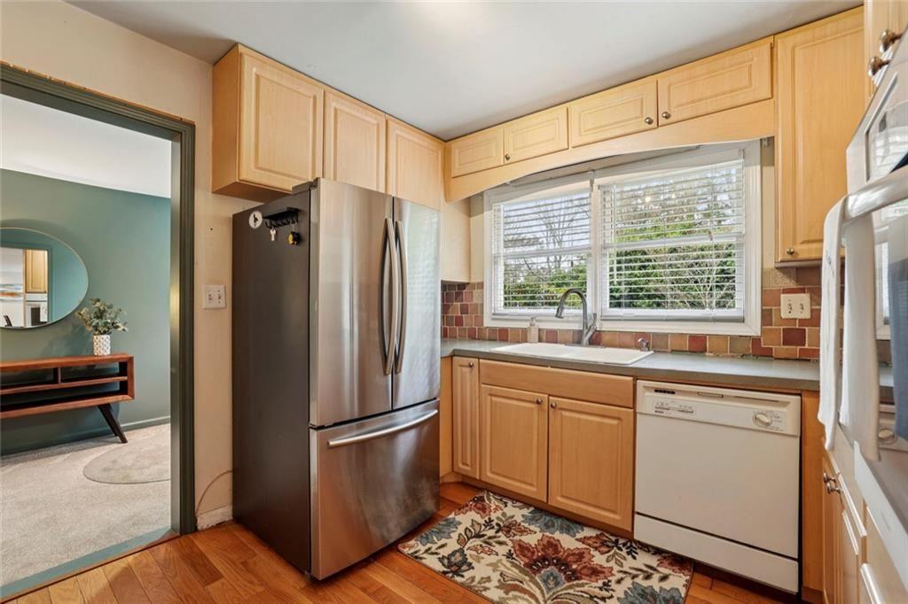 13325 Providence Road Milton, GA 30009 - Photo 11 of 50 a kitchen with stainless steel appliances a refrigerator and a sink