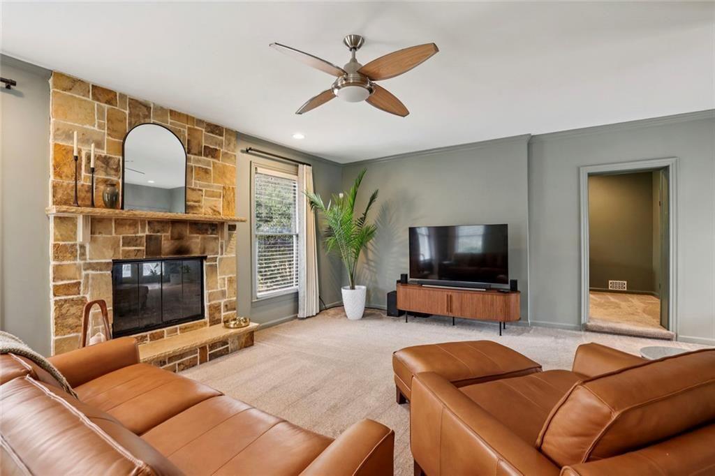 13325 Providence Road Milton, GA 30009 - Photo 17 of 50 a living room with furniture and a flat screen tv with wooden floor