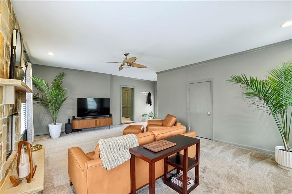 13325 Providence Road Milton, GA 30009 - Photo 18 of 50 a living room with furniture and a flat screen tv