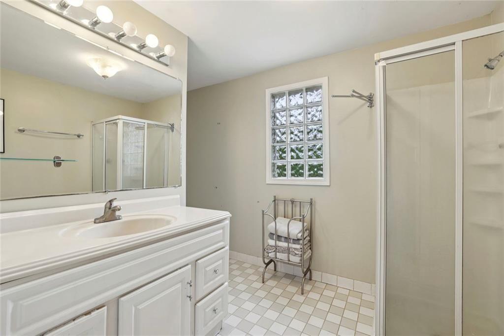 13325 Providence Road Milton, GA 30009 - Photo 24 of 50 a bathroom with a sink vanity and a mirror