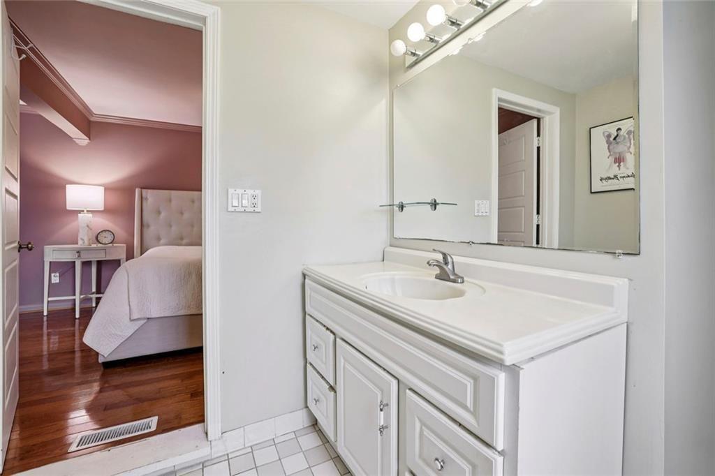 13325 Providence Road Milton, GA 30009 - Photo 25 of 50 a bathroom with a sink and a mirror