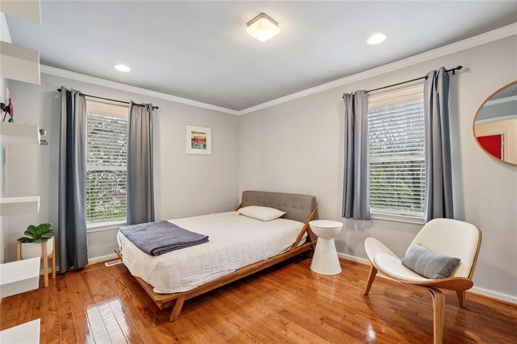 13325 Providence Road Milton, GA 30009 - Photo 29 of 50 a bedroom with a bed and a chair