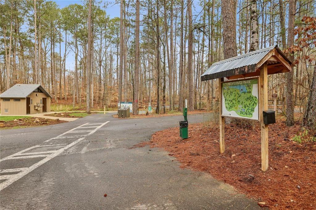 13325 Providence Road Milton, GA 30009 - Photo 39 of 50 a view of a house with backyard and trees
