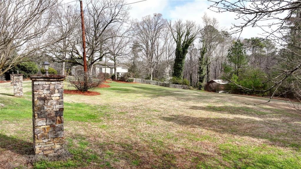 13325 Providence Road Milton, GA 30009 - Photo 49 of 50 a view of a yard with a house