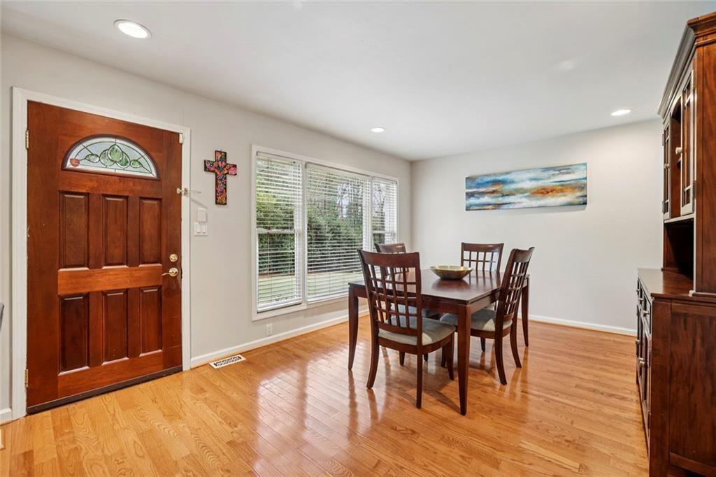 13325 Providence Road Milton, GA 30009 - Photo 6 of 50 a view of a dining room with furniture window and wooden floor