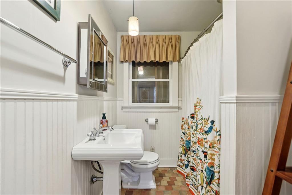 13325 Providence Road Milton, GA 30009 - Photo 10 of 50 a bathroom with a sink toilet and shower