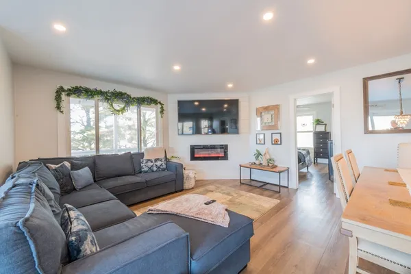 a living room with furniture and a large window