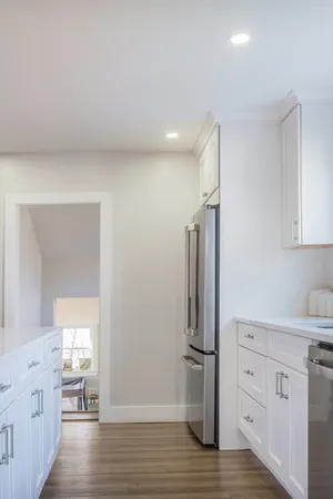 a view of cabinets and wooden floor