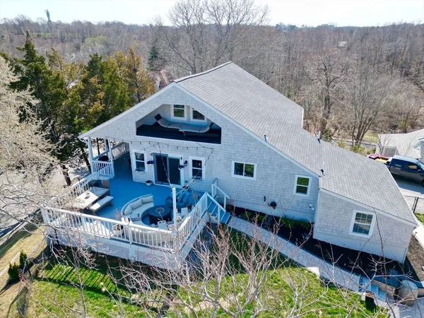 a front view of house with yard and outdoor seating
