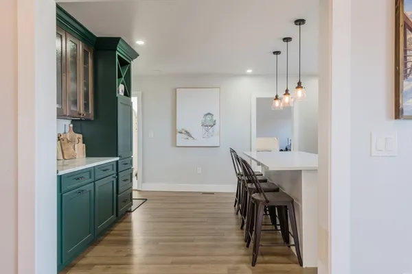 a kitchen with a table and chairs