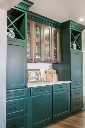 a kitchen with cabinets and window