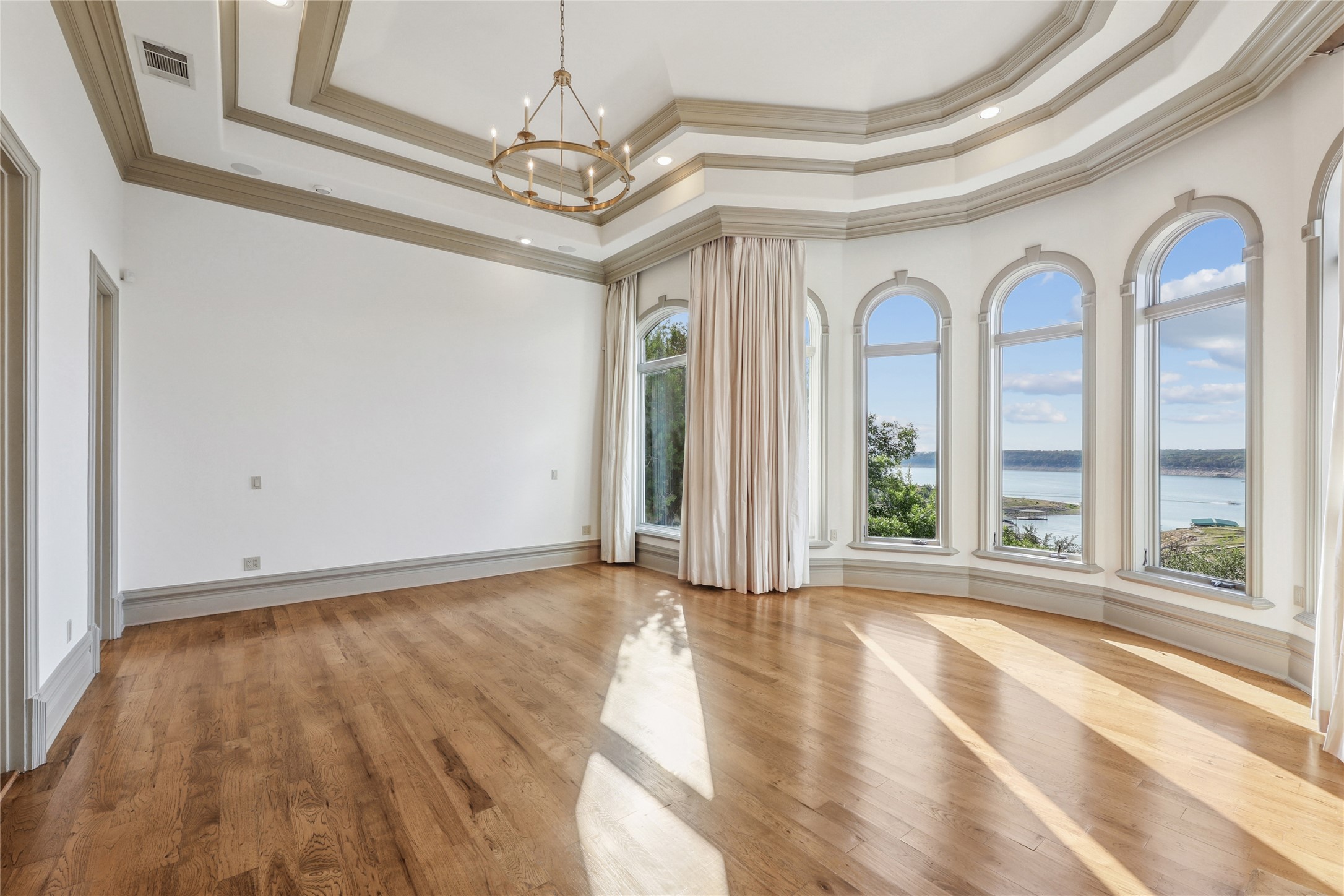 16010 Canard Circle Austin, TX 78734 - Photo 13 of 35 a view of a room with wooden floor and large windows