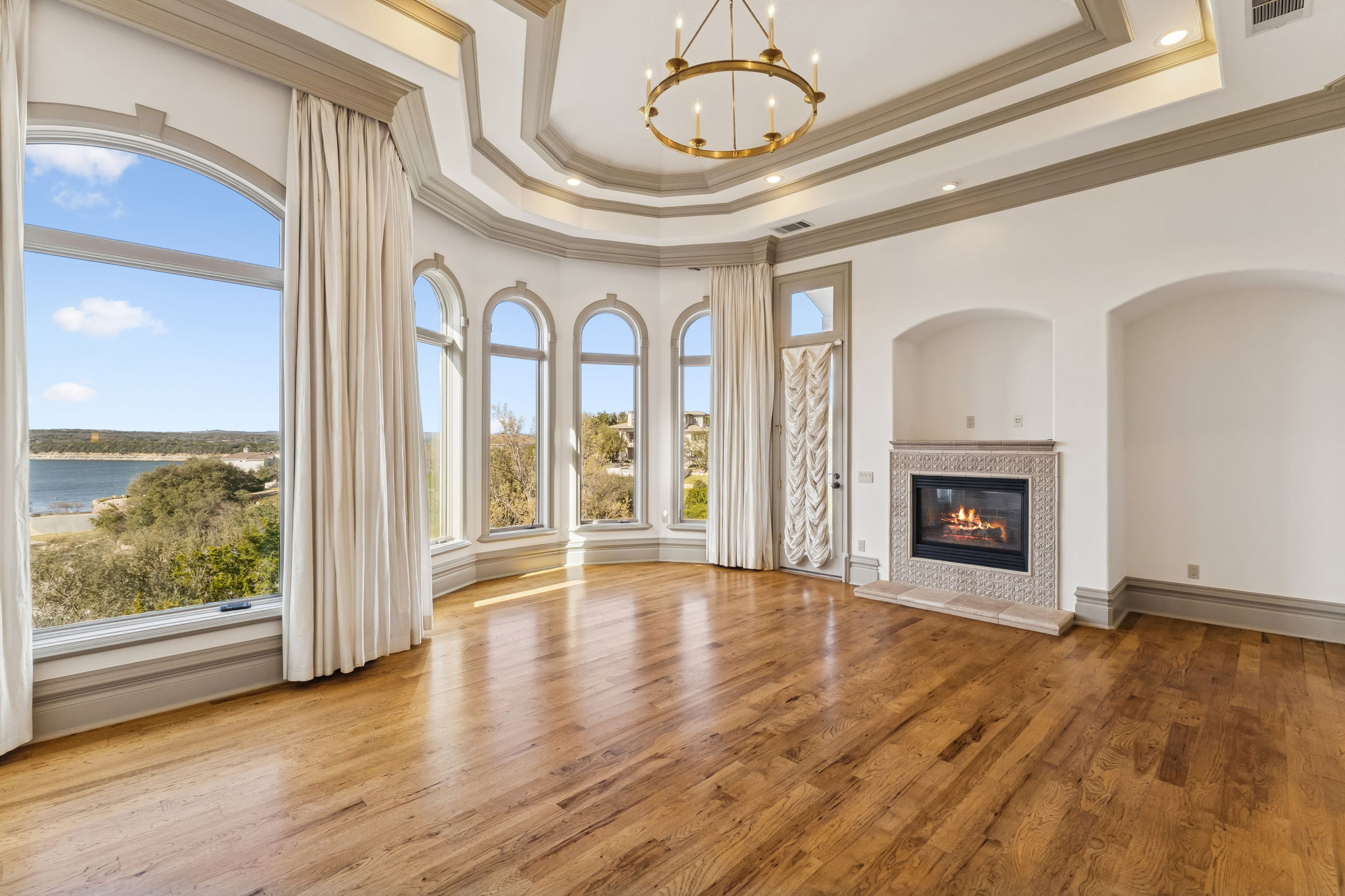 16010 Canard Circle Austin, TX 78734 - Photo 14 of 35 a view of an empty room with wooden floor and a window