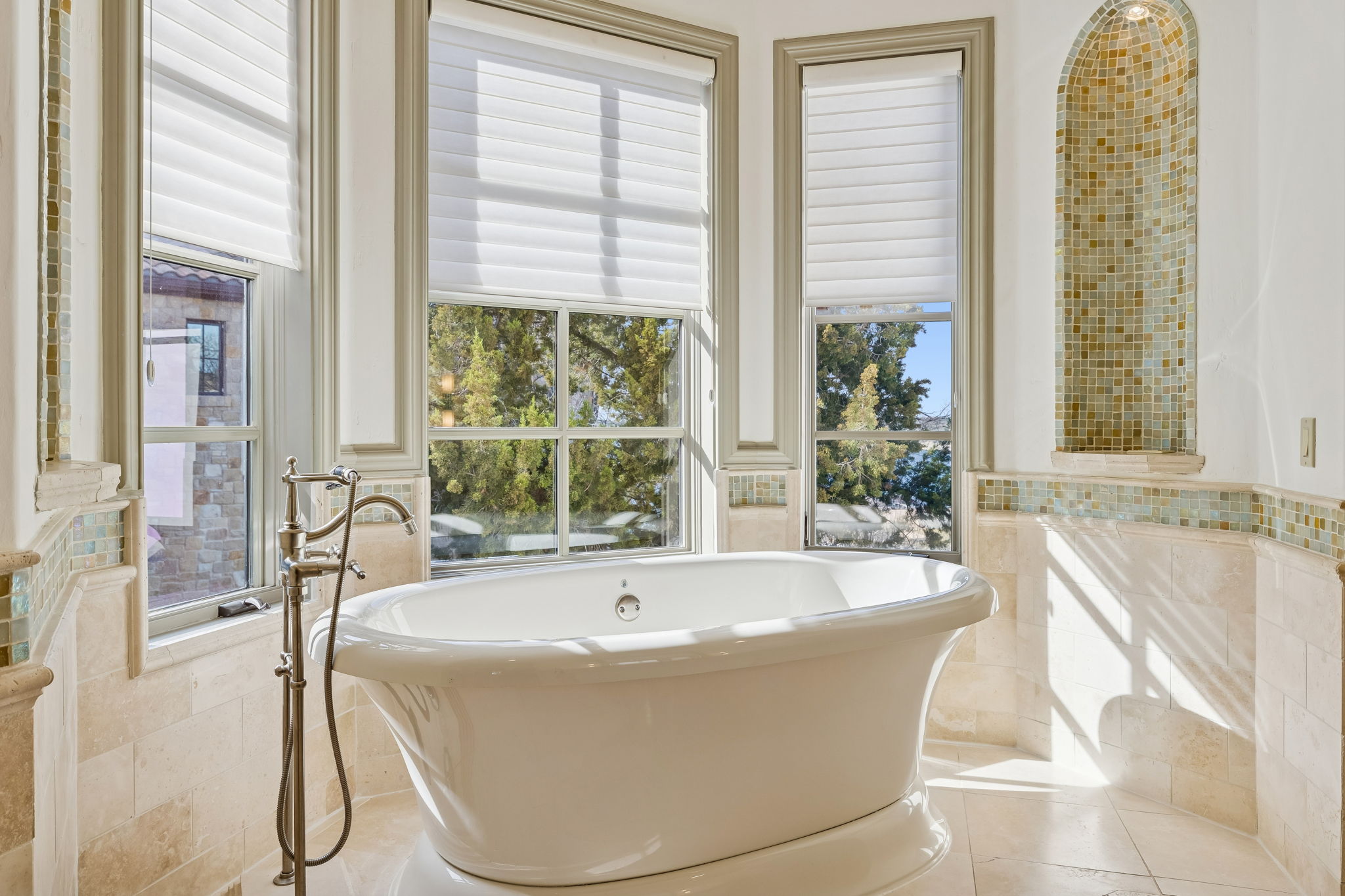 16010 Canard Circle Austin, TX 78734 - Photo 16 of 35 a white bath tub sitting in a bathroom next to a window