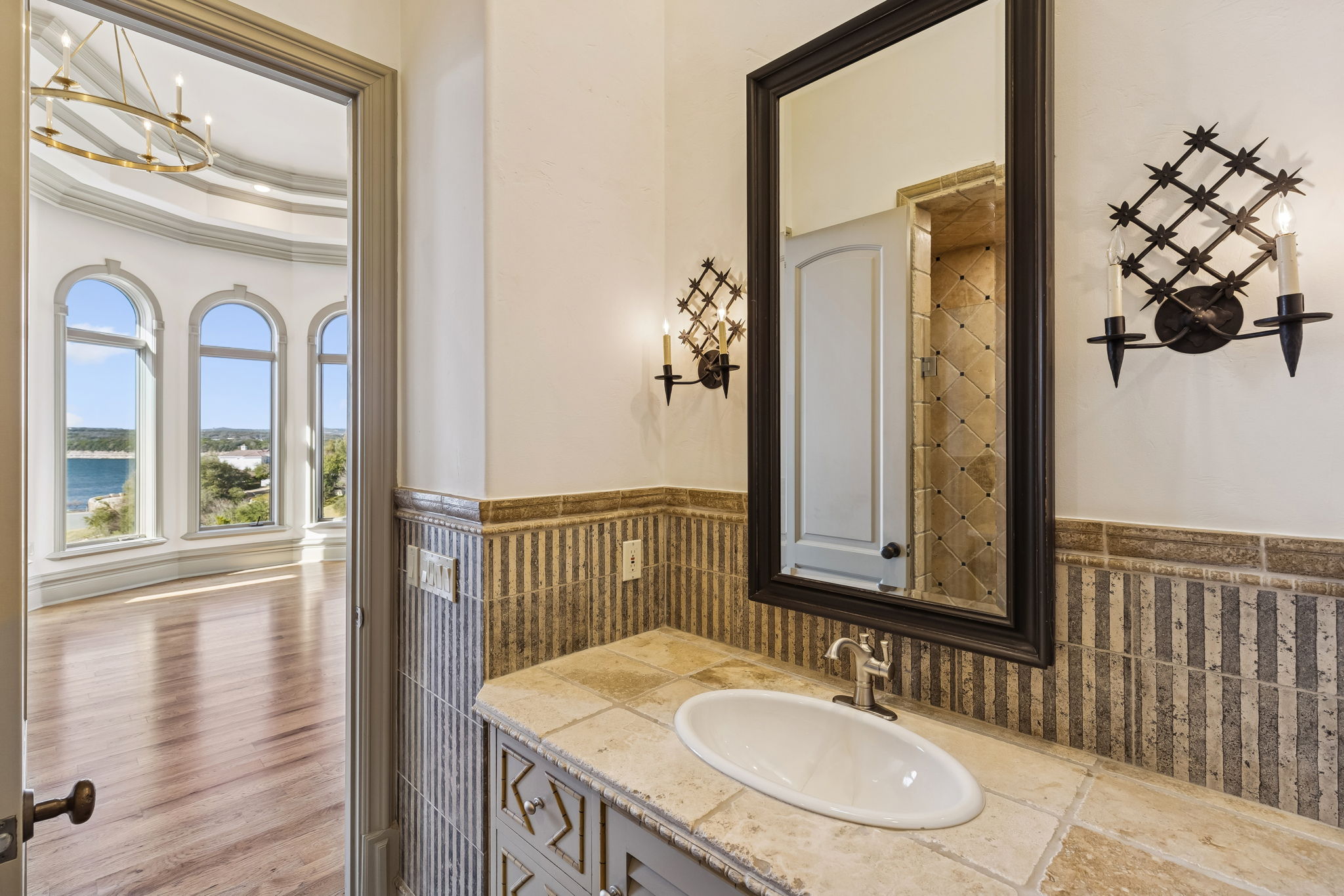 16010 Canard Circle Austin, TX 78734 - Photo 17 of 35 a bathroom with a sink vanity and a mirror