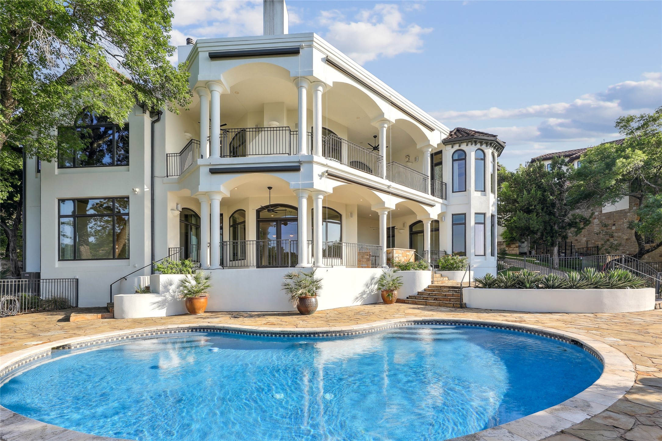 16010 Canard Circle Austin, TX 78734 - Photo 20 of 35 a view of a building with a tub and couches chairs