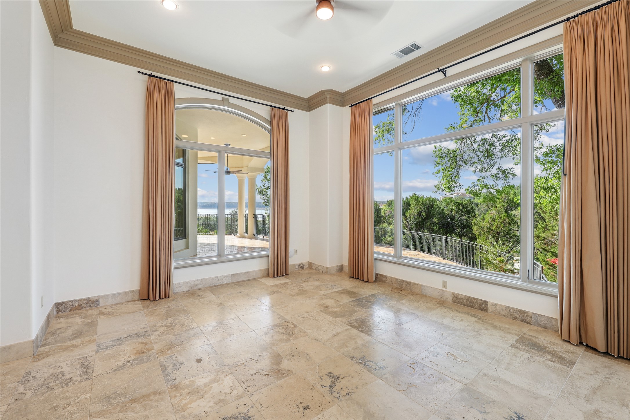 16010 Canard Circle Austin, TX 78734 - Photo 24 of 35 a view of an empty room with a sliding door and balcony