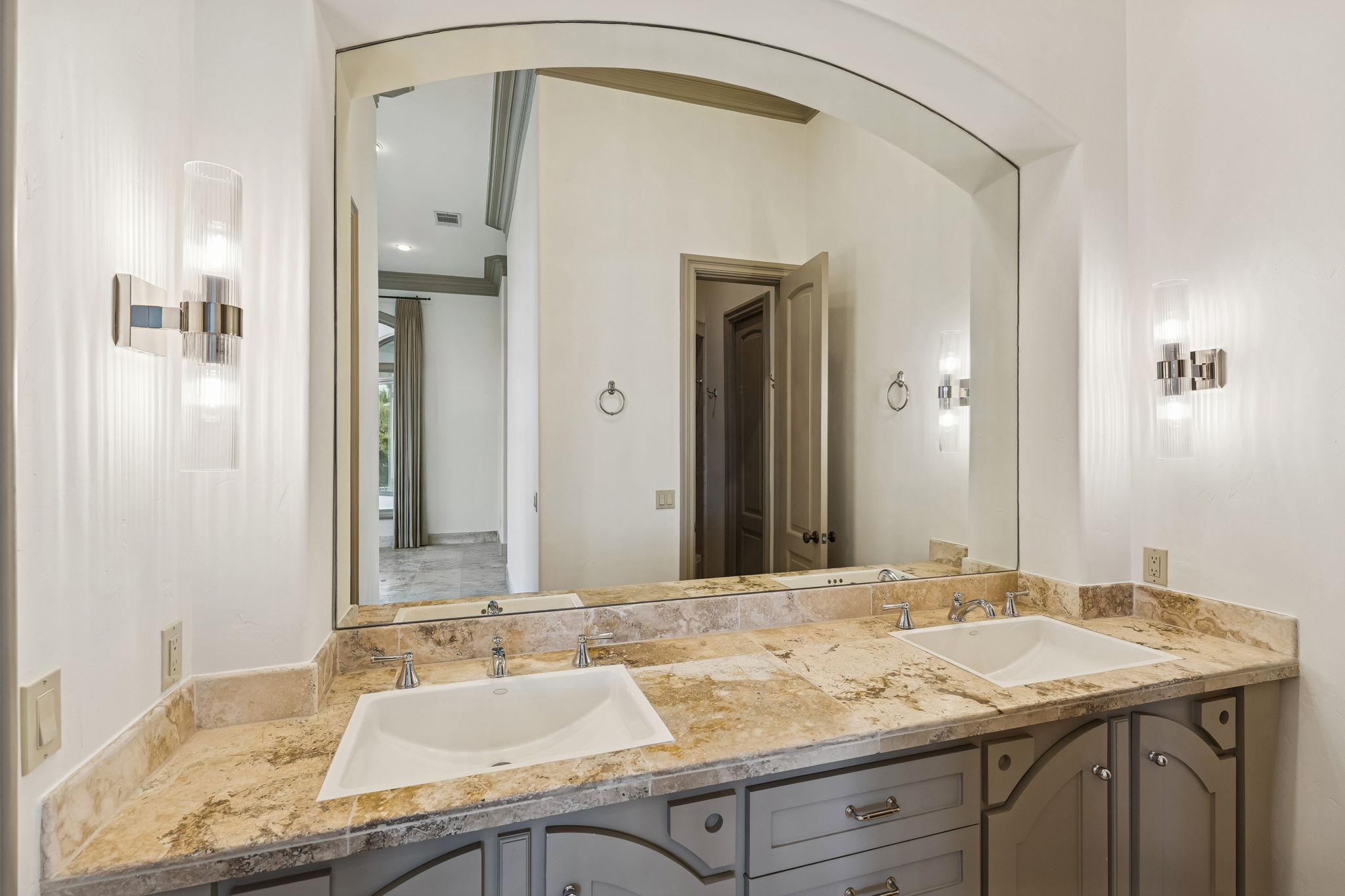 16010 Canard Circle Austin, TX 78734 - Photo 25 of 35 a bathroom with a granite countertop sink and a mirror