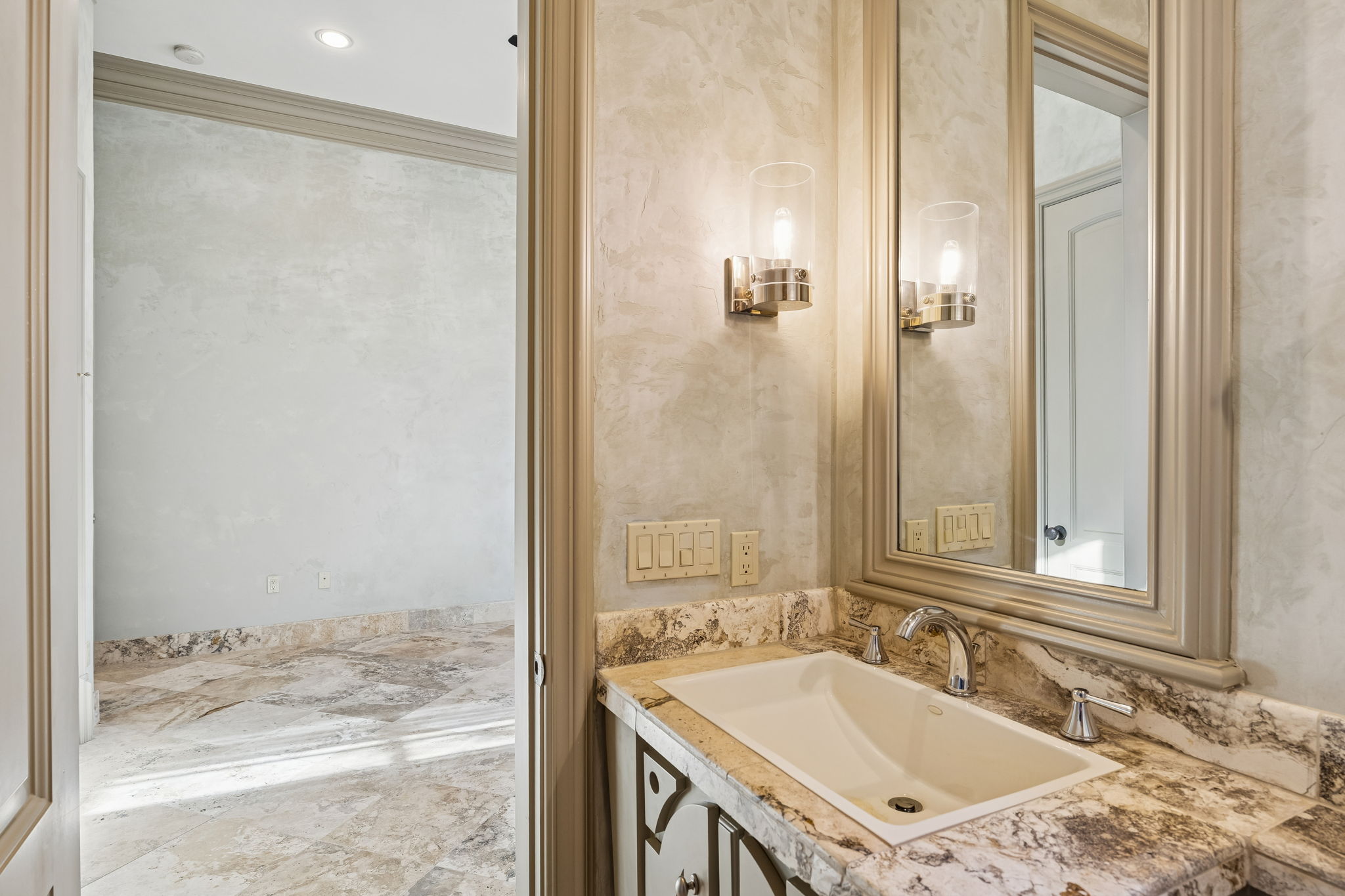 16010 Canard Circle Austin, TX 78734 - Photo 28 of 35 a bathroom with a granite countertop sink and a mirror