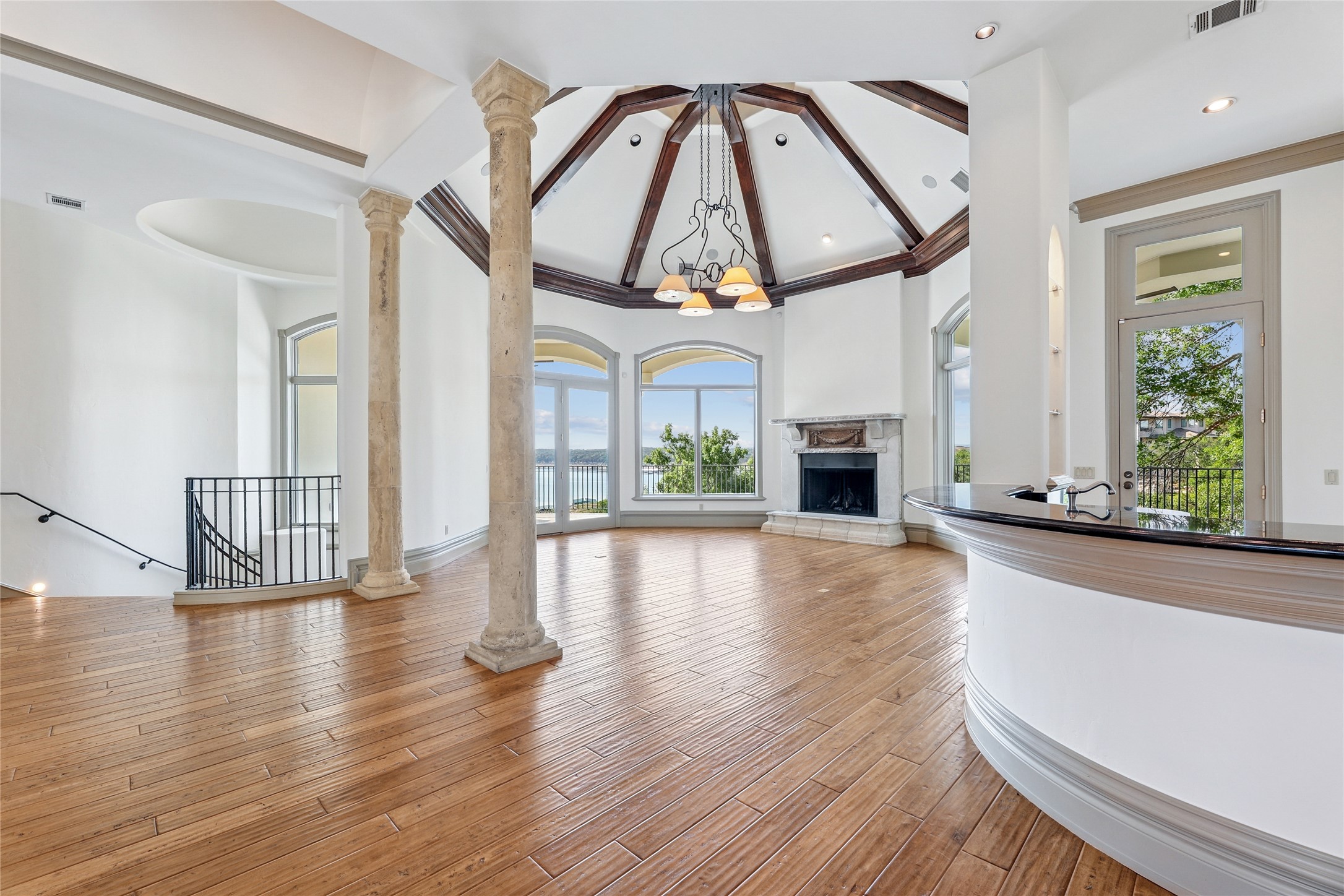 16010 Canard Circle Austin, TX 78734 - Photo 4 of 35 a view of a living room with wooden floor a fireplace and windows