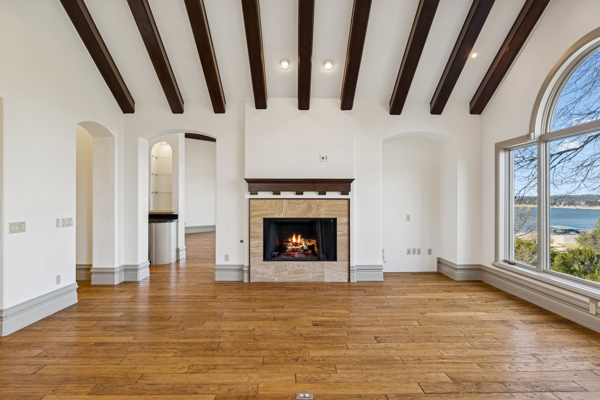16010 Canard Circle Austin, TX 78734 - Photo 10 of 35 a view of an empty room with a fireplace and a window