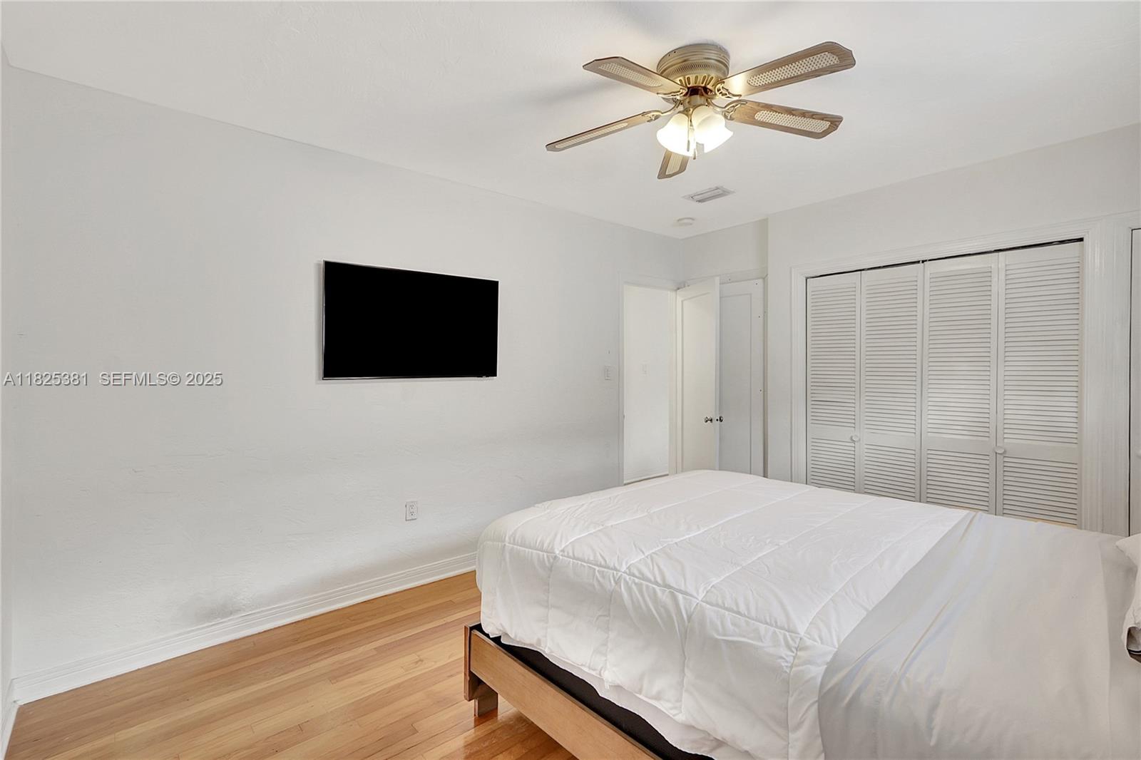 33 Southwest 20th Road Miami, FL 33129 - Photo 13 of 29 a bedroom with a bed and a flat screen tv