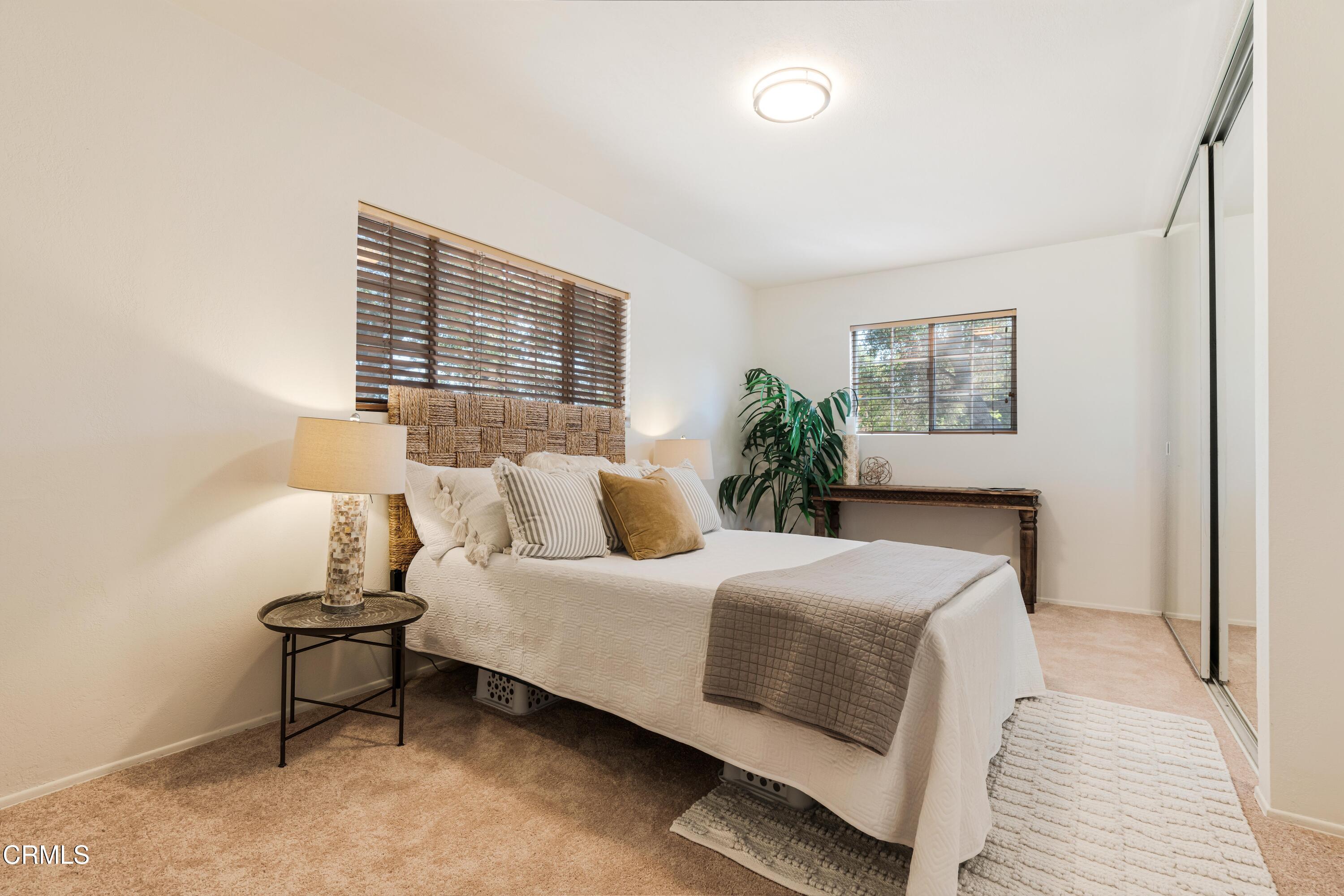 467 Riverside Road Oak View, CA 93022 - Photo 25 of 65 a bedroom with a bed and a table