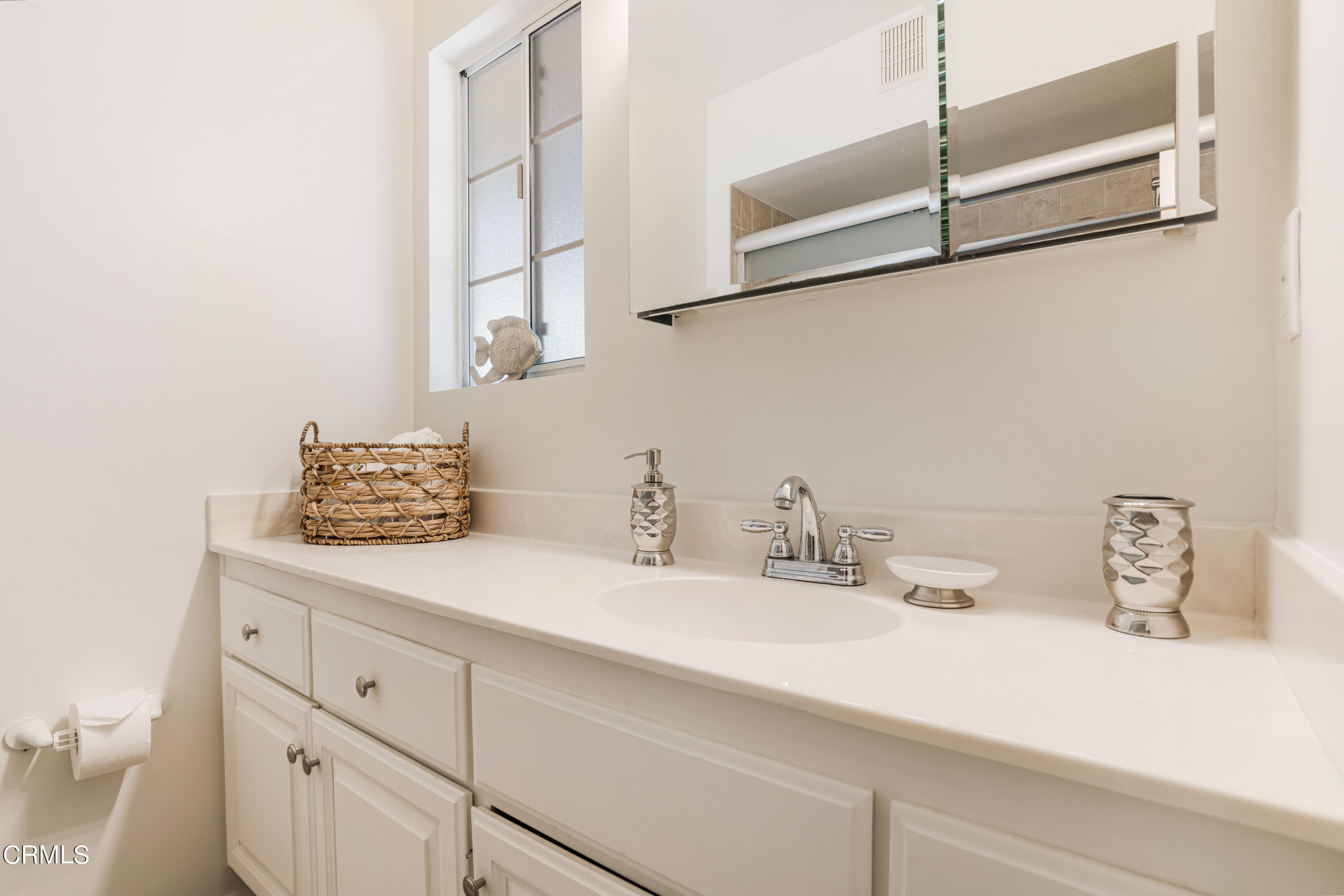 467 Riverside Road Oak View, CA 93022 - Photo 26 of 65 a bathroom with a sink and a mirror