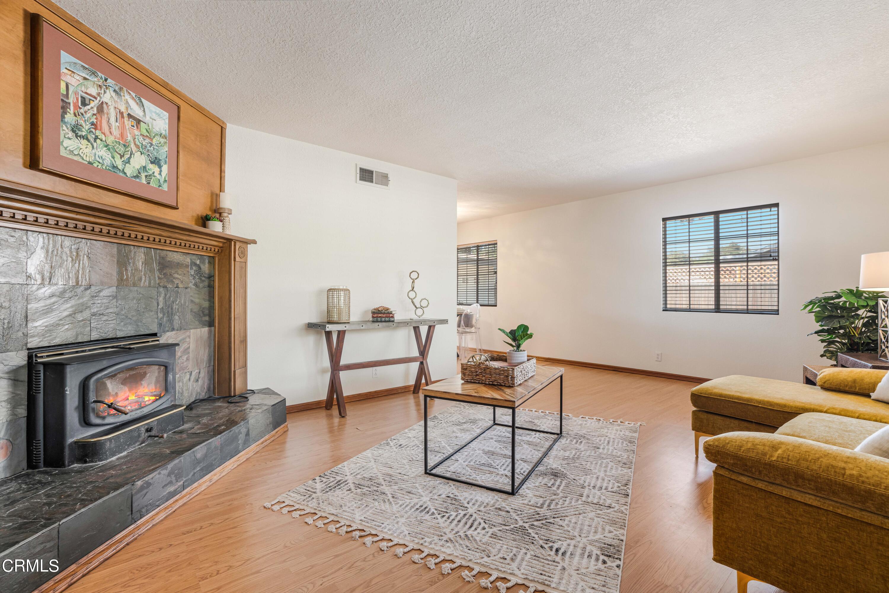467 Riverside Road Oak View, CA 93022 - Photo 6 of 65 a living room with furniture and a fireplace