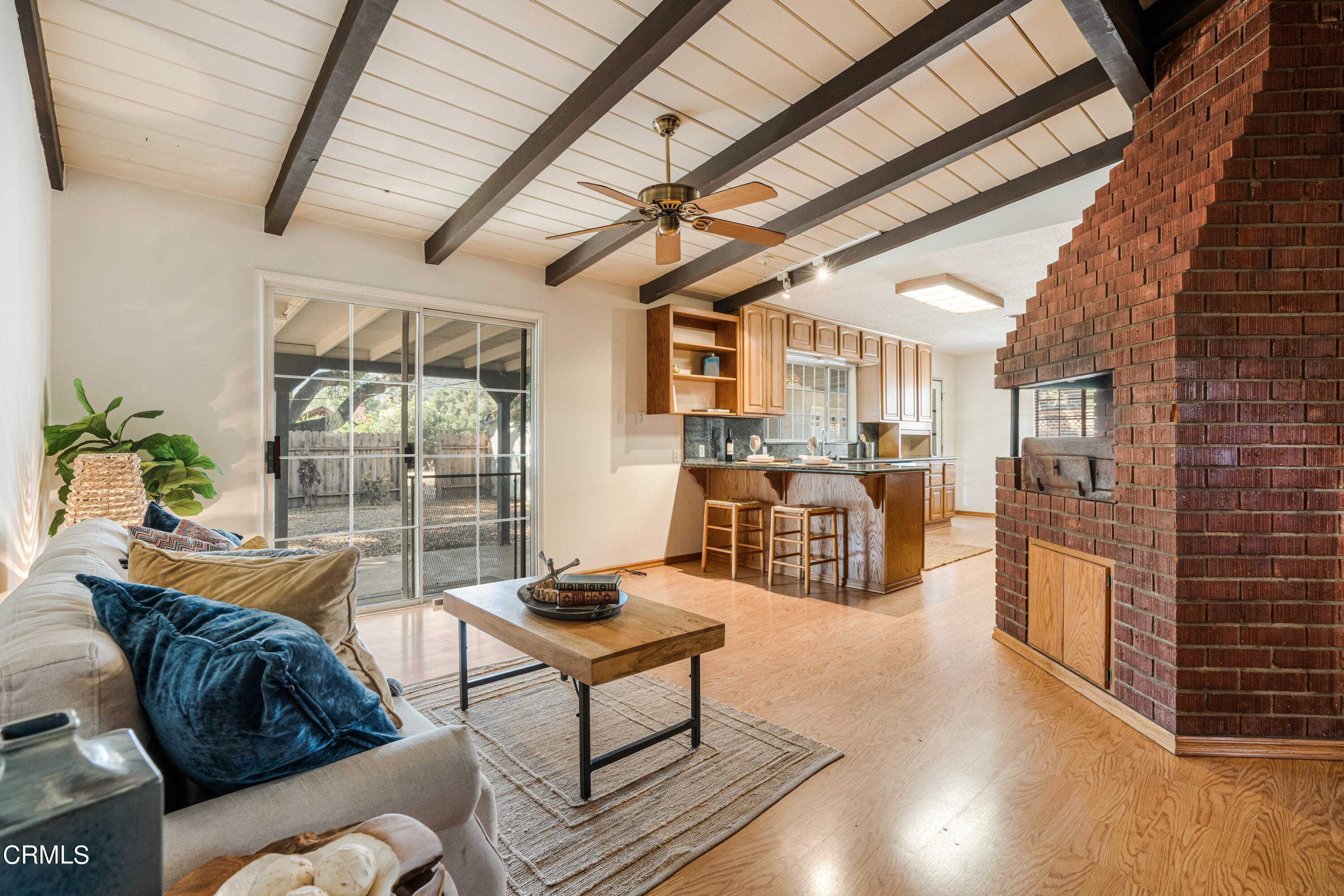 467 Riverside Road Oak View, CA 93022 - Photo 9 of 65 a living room with furniture and a floor to ceiling window