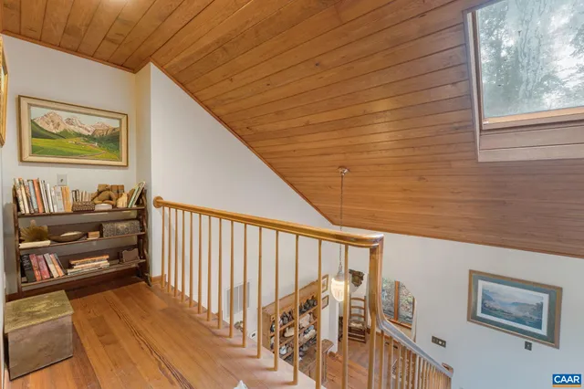 a view of balcony with furniture and umbrella