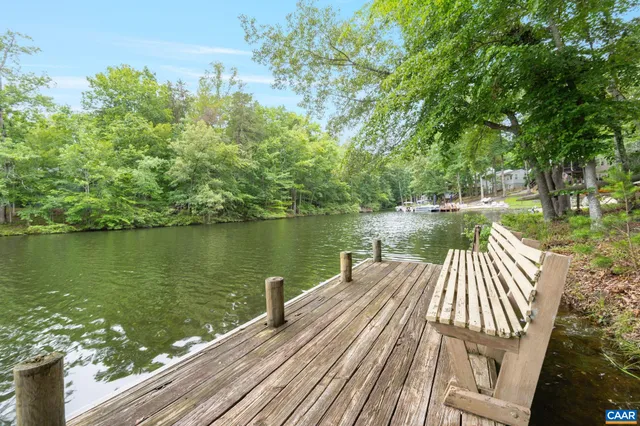 a view of a swimming pool with a lake view