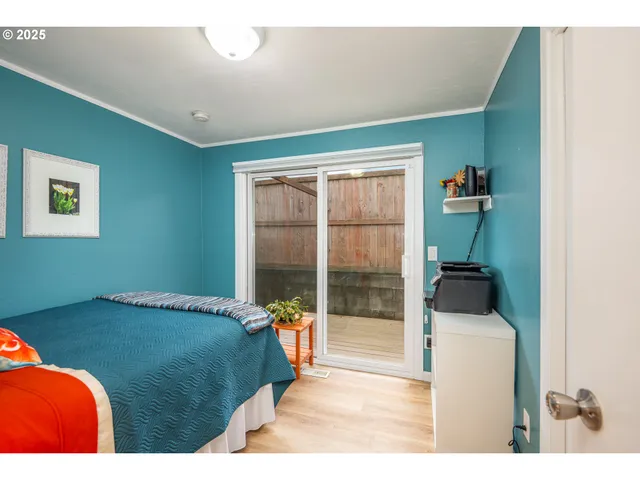 a bedroom with a bed and a television