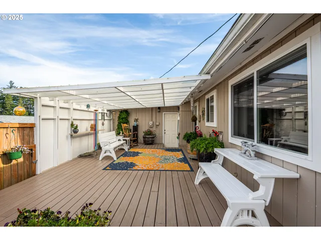 a view of swimming pool with outdoor seating and plants