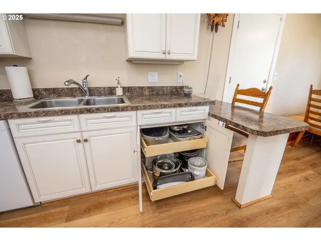 a kitchen with a stove and cabinets