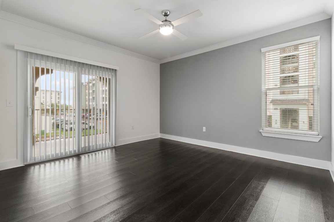 3300 Towers Boulevard, Unit 958 Seabrook, TX 77586 - Photo 16 of 33 a view of an empty room with wooden floor and a window