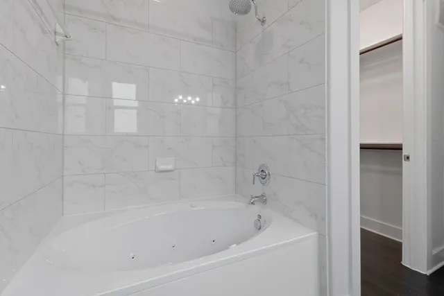 a close up of a bathtub in a bathroom