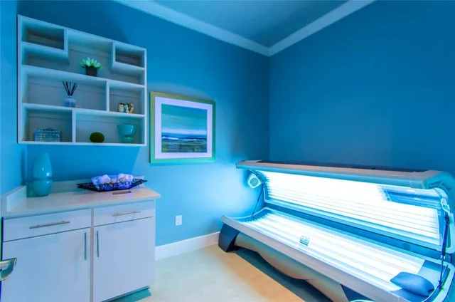 a bathroom with a bathtub and cabinets