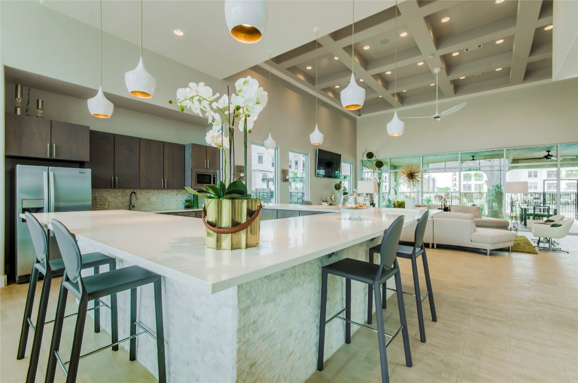3300 Towers Boulevard, Unit 958 Seabrook, TX 77586 - Photo 33 of 33 a kitchen with a table and chairs