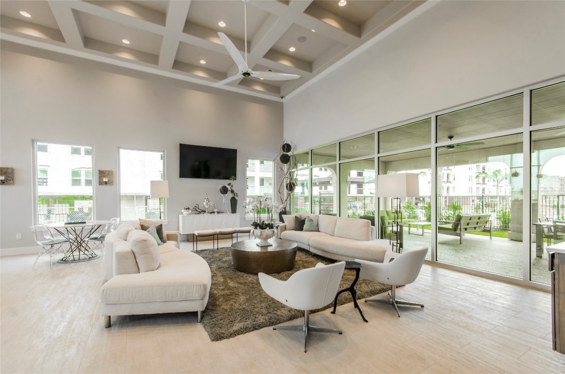 3300 Towers Boulevard, Unit 958 Seabrook, TX 77586 - Photo 30 of 33 a living room with furniture and a flat screen tv